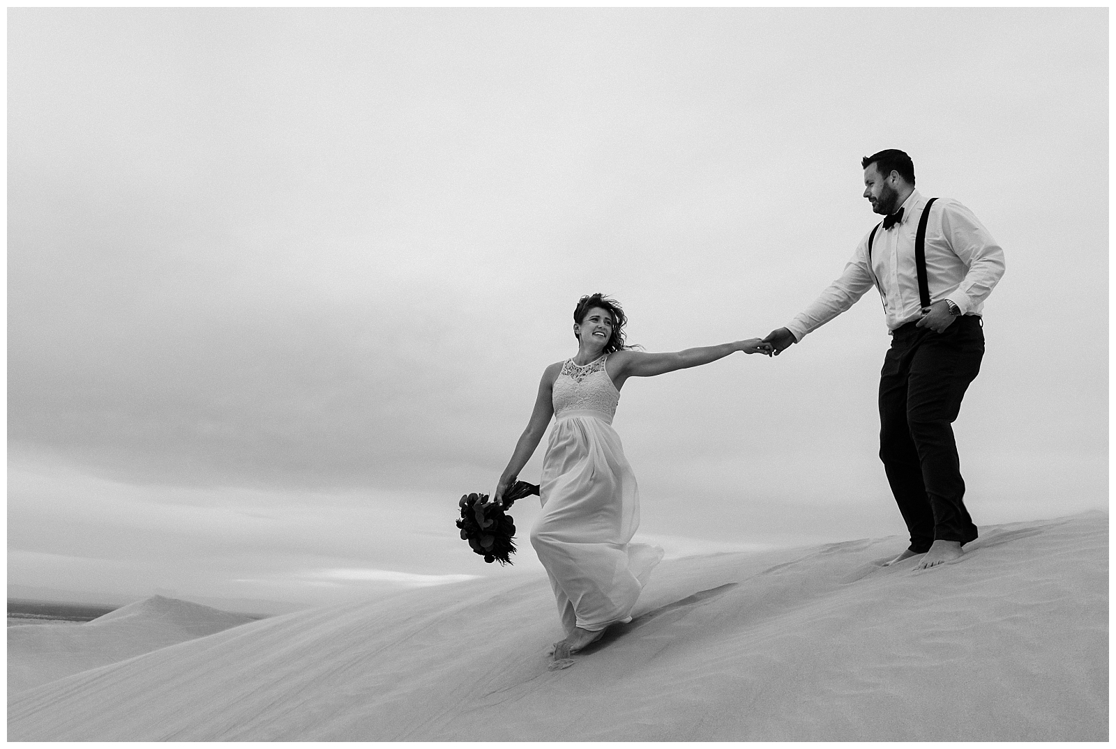 Bride and groom elope in the desert at sunset