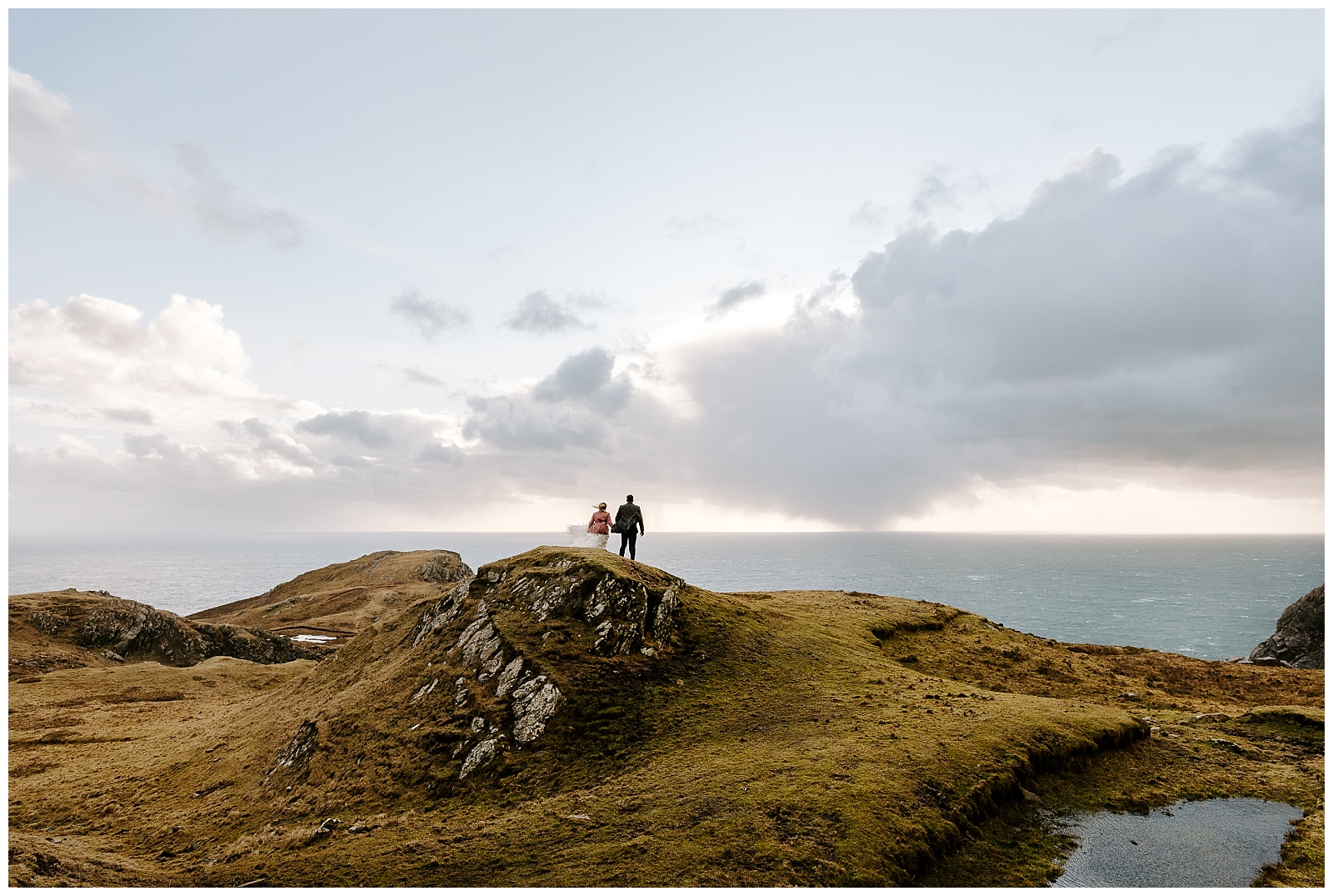 bride and groom explore the cliffs during their elopement experience