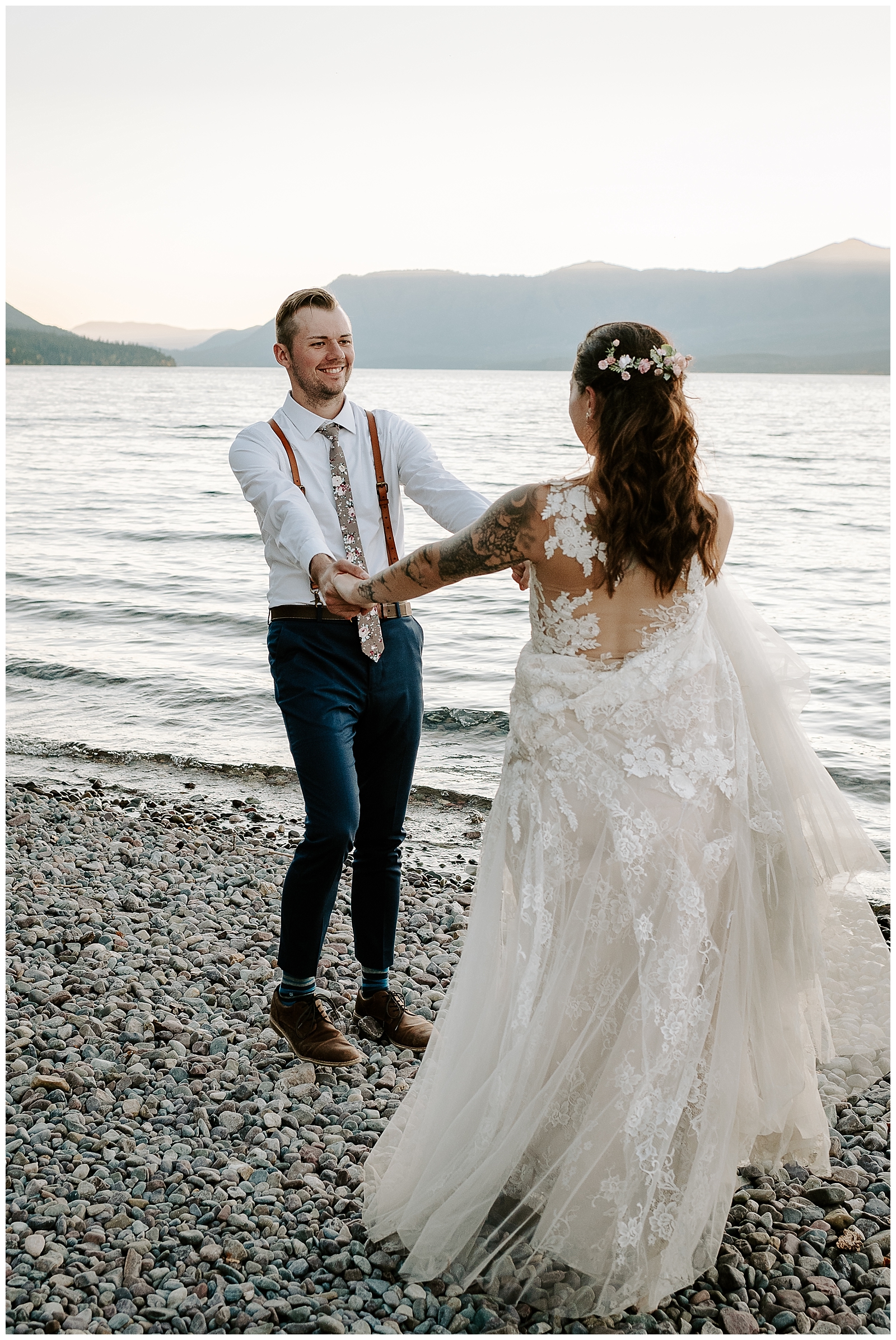 couples shares a first dance on lake McDonald